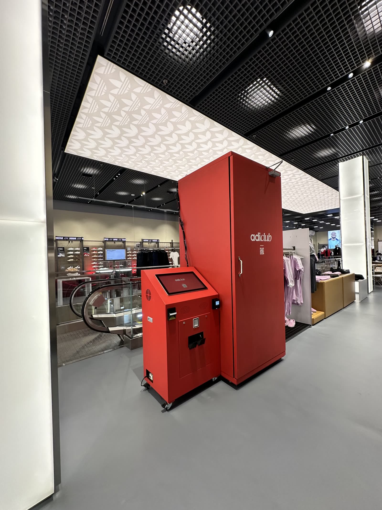 The Steel Booth installed inside an Adidas store, wrapped in adiclub branding