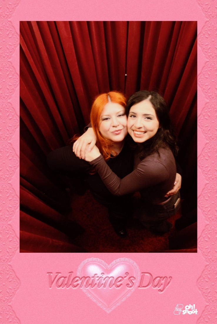 High-angle photobooth strip — friends looking up from the red room